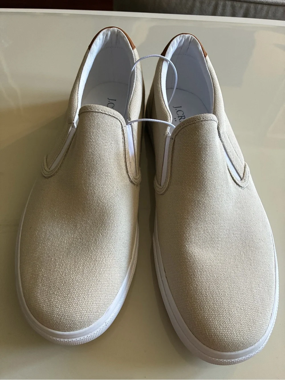 J. Crew Men's Slip-On Canvas Loafers in Light Beige with dust stain on inside.